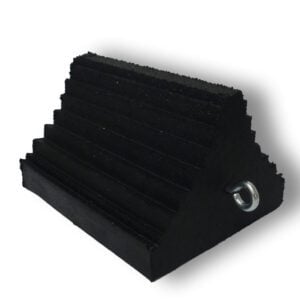 The TCT Triangle Heavy-Duty Wheel Chock - Ribbed Double Sided Black (10x8x6) has a ribbed, double-sided black surface for enhanced grip, a sturdy metal ring, and effectively prevents vehicle movement. It is featured against a plain white background.