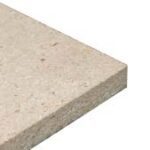 Close-up image of a beige, rectangular fiberboard with a smooth surface and visible specks, reminiscent of materials used in cannabis growing facilities, showcasing its thickness and texture.