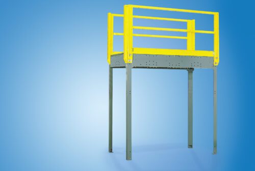 catwalk.jpg An elevated yellow and gray industrial safety platform with railings, reminiscent of a structural mezzanine, stands against a solid blue background. Supported by four sturdy legs, it embodies both functionality and robust design.