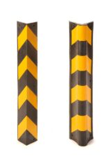 Two TCT Corner Guard - Heavy Duty, Rounded, 31L rubber corner guards with black and yellow diagonal stripes stand upright against a white background. One guard is slightly rotated to highlight its rounded profile for optimal wall protection.