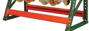 A metal spool rack with green sides and an orange horizontal bar supports several large spools of wire. The rack is shown against a white background.