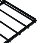 Close-up of a black metal rack with horizontal and vertical bars forming a grid pattern. The corner of the rack is visible against a white background.