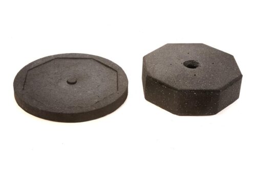 Two black rubber weight plates are on a white background. The left plate is circular with an octagonal ridge, and the right is octagonal with a center hole. They work as TCT Round extender bases, adding to a 60 lb base to efficiently reach your 90 lbs goal.