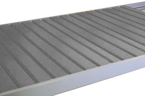 v20grip20rack20-20steel20decking_OFFICE20GRAY.jpg A close-up of a corrugated metal sheet with parallel ridges, used in roofing or siding. The sheet is gray with a slightly reflective surface, captured at an angle to show its texture.