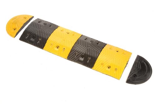 The TCT 5-10 MPH Speed Bump features alternating yellow and black sections with two half-circle end pieces, and measures 13.5 wide, 39.25 long, and 2 tall in the middle.
