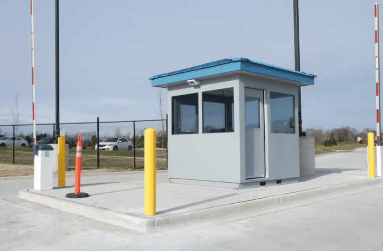 Prefabricated guard booth at a gated vehicle entrance