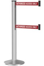 A metallic stanchion with two horizontal red belts labeled AUTHORIZED ACCESS ONLY in white text. The belts are positioned parallel to each other on the stanchion, which is mounted on a circular base.