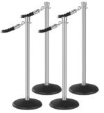 The Visiontron Outdoor ST400 Series Urn Top Bundle includes four sleek silver stanchion posts with round black bases, linked by elegant black velvet ropes at the top to form a sophisticated barrier.