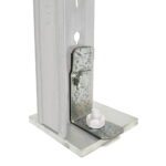 A galvanized steel post bracket mounted on a flat square base with a bolt and nut securing the structure. The bracket features a vertical support designed for stability, with a metallic finish highlighting its durable construction.