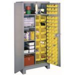 A gray metal storage cabinet with an open door reveals organized shelves. Inside, there are yellow plastic bins filled with various tools and supplies. The cabinets door also has smaller yellow bins holding small items like screws and bolts.