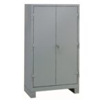 A gray metal storage cabinet with double doors, a central handle, and visible hinges. It stands on a solid base, set against a plain white background.