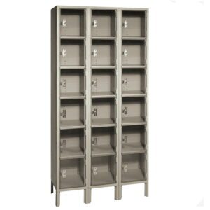 A gray, three-column metal locker unit with transparent doors. Each column contains six individual lockable compartments, totaling eighteen compartments. The unit stands on four legs and has a sturdy appearance.