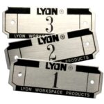 Three silver, rectangular nameplates labeled LYON with the numbers 3, 2, and 1. They have small holes for attachment and include the text Lyon Workspace Products at the bottom.