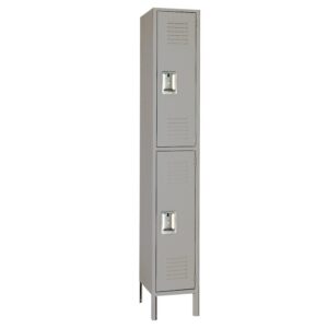 A tall, narrow gray metal locker with two compartments, each with a handle and ventilation slots. The locker stands upright on four legs.