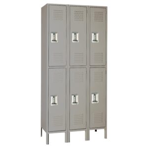 A gray metal locker unit with six compartments arranged in two columns and three rows. Each locker has a vented door with a handle. The unit stands upright with small legs at the bottom.