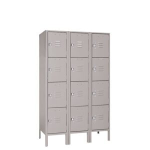A metal locker unit with three columns and four rows of doors. Each door has a small ventilation slot and a circular lock. The lockers are painted gray and stand on short legs.