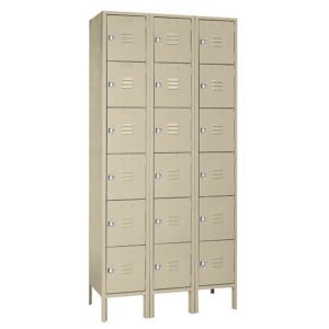 A beige, three-column locker unit with five rows, totaling fifteen compartments. Each locker has a small silver lock and a vent. The unit stands on metal legs.