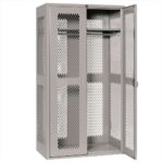 A tall, gray metal locker with perforated mesh doors is open. The interior features a shelf and a clothing rod for storage. The door is partially ajar, showing the spacious interior suitable for storing various items.
