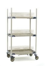 Introducing the MetroMax i PR36VX2-XDR Mobile Drying Rack with Three Tray Racks, measuring 26 x 38 x 68. It features a sleek metal design with slatted shelves, a drip tray, and a plain white finish. The rack glides effortlessly on four swivel wheels.