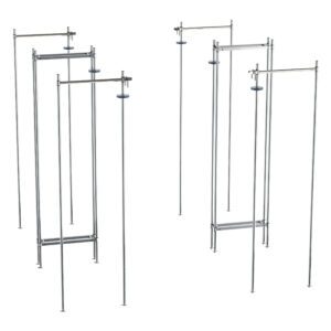 Tall, metallic modular structures with scaffolding-like frameworks and adjustable joints resemble the Metro LTTE24C Top-Track Double Deep Stationary End Unit Kit for 24 Wide Super Erecta Wire Shelving, Chrome, offering both stability and versatility.