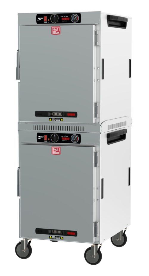 The Metro HBCW16-AS-M HotBlox Wide 16-Pan Insulated Dual-Cavity Mobile Holding Cabinet features a stainless steel finish, dual stacked compartments with analog controllers, and iconic red Hot Blox logo on solid doors. Its equipped with wheels for easy mobility and runs on (2X) 120V, 875W power.