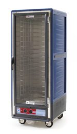 The Metro C539-HXFC-4-BUA C5 3 Series, a full-height insulated cabinet with a clear door and fixed wire slides, runs on 220-240V at 50/60Hz. It features a blue design with wheels for mobility and control knobs for precise temperature regulation.