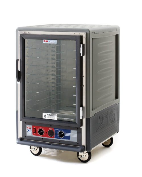 The Metro C535-MXFC-U-GYA is a 1/2 height insulated moisture heated holding/proofing cabinet with a full-length clear door, universal wire slides, and operates at 220-240V, 50/60Hz. It features control knobs, mobility wheels, and a gray finish with branding on the bottom panel.