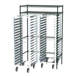 A green metal shelving unit supports two Metro CR742448DOCK Docking Stations, tall and silver, with multiple shelves. Designed for easy mobility and storage optimization, these racks provide a perfect organizational solution for any space.