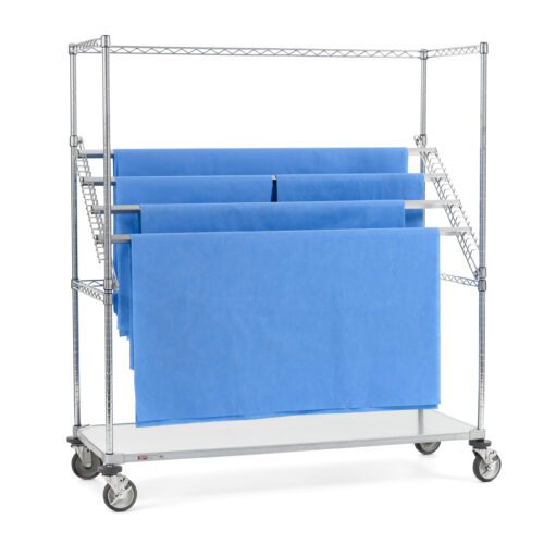The Metro SWR566EG Super Erecta High-Profile Sterile Wrap Rack features a 24 x 60 metal frame with wheels and holds four blue fabric sheets on horizontal bars. Its open design includes a solid bottom shelf, ideal for storage or display.