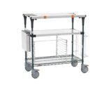 The Metro MS1836-FSNK-PK2 PrepMate MultiStation 36 Prep Station with Accessory Pack 2 includes a Solid Stainless Steel top shelf, a Metroseal Green Epoxy Wire bottom shelf with Stainless Steel posts, wire basket, four large wheels, and support handles for versatile storage needs.