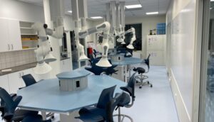 Movex ESD fume extraction arms mounted along an electronics laboratory bench
