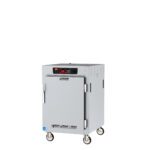The Metro C585-SFS-UA is a 1/2 height insulated reach-in holding cabinet with universal wire slides, a full-length solid door, and a digital display. It features compact ventilation, safety warnings on the sides, and is equipped for mobility with wheels.