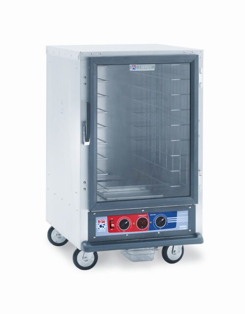 The Metro C515-PXFC-4 C5 1 Series is a half-height stainless steel proofing cabinet on wheels with a transparent door, interior racks, and a bottom control panel featuring two black knobs and several setting buttons. It operates at 220-240V, 50/60Hz, with a power range of 1210-1440W.