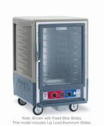 The Metro C535-CLFC-L-GY is a 1/2 height insulated holding/proofing cabinet with Lip Load Aluminum Slides and a full-length clear door, featuring bottom knobs for precise temperature control. It is mobile, has visible branding and control labels near the base, operates at 120V, 60Hz, and delivers 1440W of power.