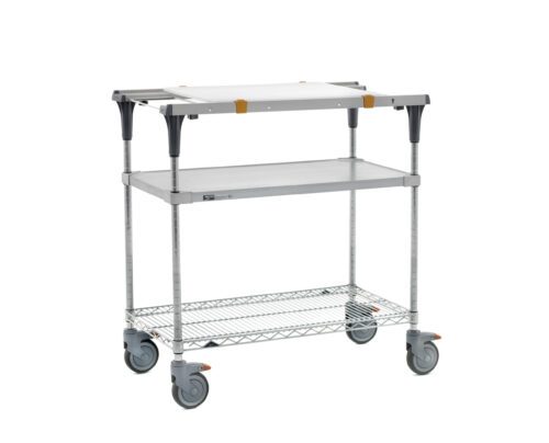 The Metro MS1836-FGBR-PK1 PrepMate MultiStation 36 prep station includes accessory pack 1, featuring a solid galvanized top shelf and Brite Zinc wire bottom shelf with chrome posts. It has four swivel wheels for versatility in various uses.