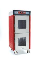 The Metro C549-ASDC-UA C5 4 Series is a full-height insulated holding cabinet with red and stainless steel design, featuring Dutch clear doors and universal wire slides. It runs at 120V, 60Hz, and 1400W, ideal for commercial use. Its control knobs are on top with visible shelving inside.