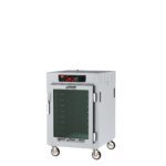 The Metro C585-SFC-UPFS C5 8 Series Holding Cabinet is a silver, half-height commercial warmer with a full-length clear door, digital display, and control panel. It features universal wire slides and four caster wheels for mobility, operating at 60Hz to maintain ideal temperatures.
