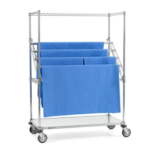 The Metro SWR556EG Super Erecta High-Profile Sterile Wrap Rack, featuring a 24 x 48 solid bottom shelf and adjustable wire frame holders for blue folded sheets, is equipped with four caster wheels, enhancing mobility for organized storage.