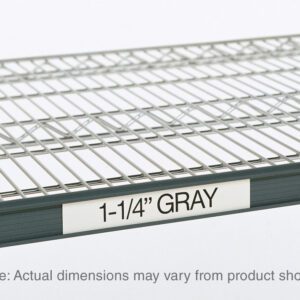 Close-up of a metal wire shelf showcasing a Metro 9990P1 Super Erecta Label Holder in gray, labeled 1-1/4. Note: Actual dimensions may vary from product shown. The empty shelf is against a plain background.