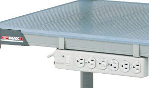A metal workbench with a gray textured surface includes an advanced Metro PSX Power Strip on the side, featuring multiple outlets and a circuit breaker button. Supported by durable metal legs, this sturdy workspace ensures efficiency in any setting.