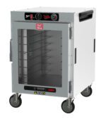 The Metro HBCW8-AC-M HotBlox Wide 8-Pan Insulated Mobile Holding Cabinet features a clear door, analog controller, adjustable shelves, temperature gauge, and caution labels. It operates at 120V/60Hz with 875W power and is NEMA 5-15P compatible for convenience.