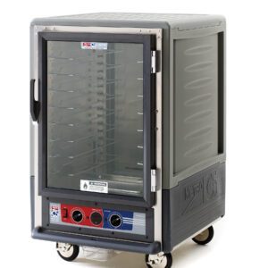 The Metro C535-MFC-U-GYA C5 3 Series is a 1/2 height insulated moisture heated holding/proofing cabinet with a full-length clear door and universal wire slides. It features multiple interior racks, control knobs, wheels for easy transport, and an industrial gray design, operating at 120V and 60Hz.