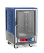 The Metro C535-MFC-U-BU is a blue 1/2 height insulated food warming cabinet on wheels with a full-length clear door, universal wire slides, and control knobs with temperature indicators on the 120V front panel.