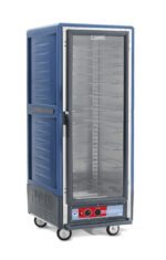 The Metro C539-HLFC-U-BUA C5 3 Series Insulated Holding Cabinet features a tall, blue design on wheels with a full-length clear door, showcasing metal racks inside. Its equipped with control knobs and perfect for efficient food transport at 60Hz.