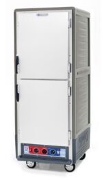 The Metro C539-CLDS-U-GY is a full-height, insulated holding/proofing cabinet with sleek gray Dutch solid doors, mounted on wheels. It features two compartments with handles, bottom control panel with dials and indicator lights, and universal wire slides for versatile storage.