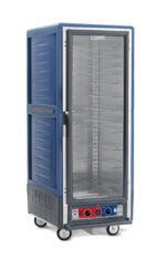 The tall, blue Metro C539-CFC-U-BU C5 3 Series Insulated Holding/Proofing Cabinet features a full-length clear door, multiple adjustable racks with universal wire slides inside, control knobs and indicators on the base, and four wheels for easy mobility.