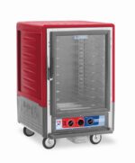 The Metro C535-MXFC-UA C5 3 Series cabinet is half-height with a full-length clear door and universal wire slides, available in red. It operates on 220-240V at 50/60Hz, consuming 1681-2000W. Equipped with wheels for mobility, it has multiple rack levels and three control knobs at the bottom.