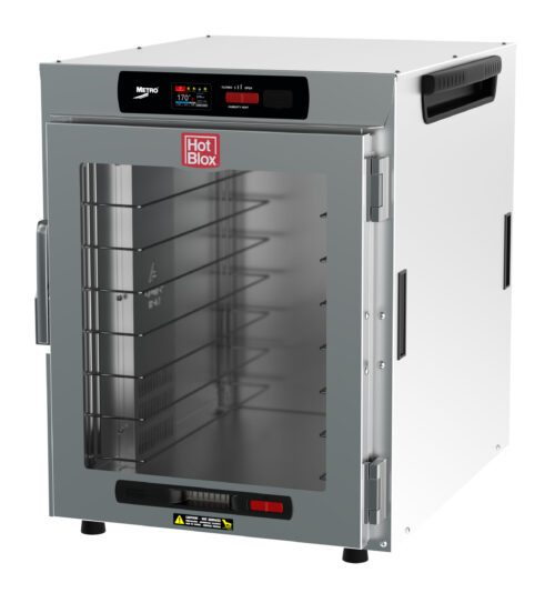 The Metro HBCW8-DC-CT HotBlox Wide 8-Pan Insulated Countertop Holding Cabinet, powered at 875W and 120V, features a clear front door revealing five metal racks. A digital touchscreen controller is on top, with the stylish Hot Blox logo displayed prominently for both function and style.