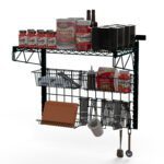 The Metro CR36SWPREP SmartWall Prep Unit, mounted on the wall, neatly holds tomato paste cans, spice jars, bowls, soft drink cartons, a mug, measuring spoons, a cutting board, and utensils in its baskets.