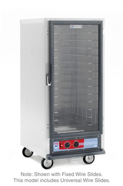 The Metro C517-HXFC-U C5 1 Series Holding Cabinet, 3/4 height, features a transparent front door and universal wire slides with control knobs positioned at the bottom. Designed for convenience, it operates at 220-240V and includes wheels for easy mobility.